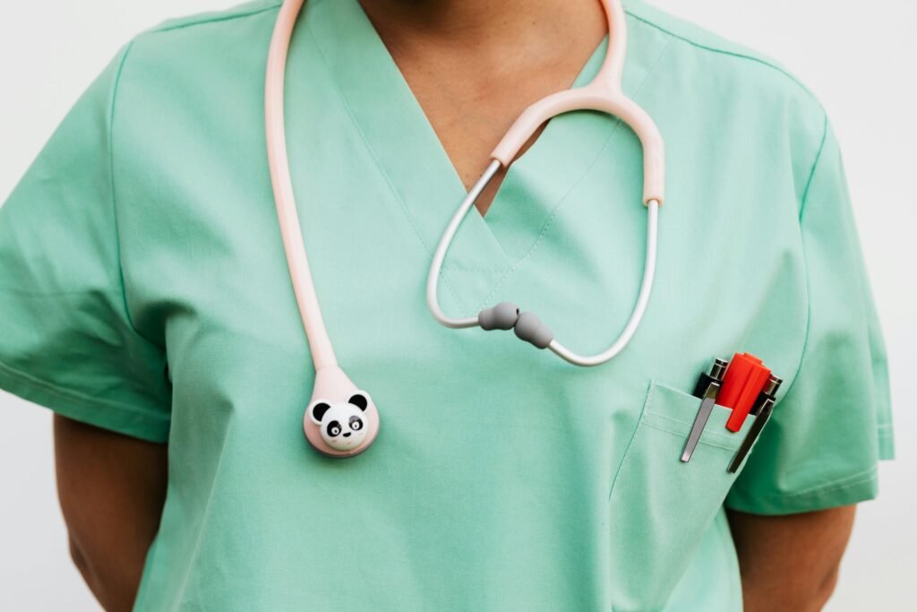 pexels-photo-5206934-5206934 Close-up of a medical professional wearing scrub suit and panda-themed stethoscope